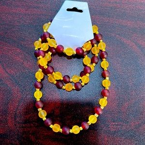 30 1/2in dark red and yellow belly chain with gold square spacers